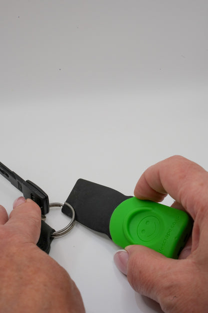 SafeScrape plastic scraper opening a keyring easily