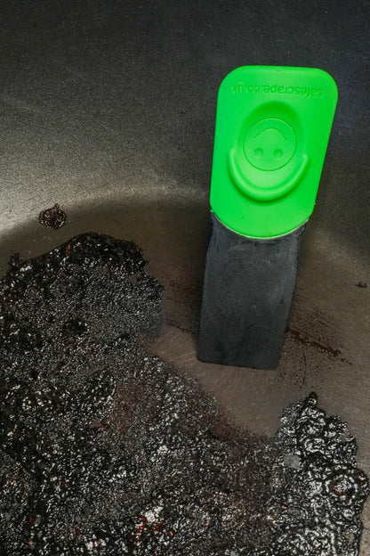 SafeScrape non-scratch scraper cleaning burnt pan without scratching